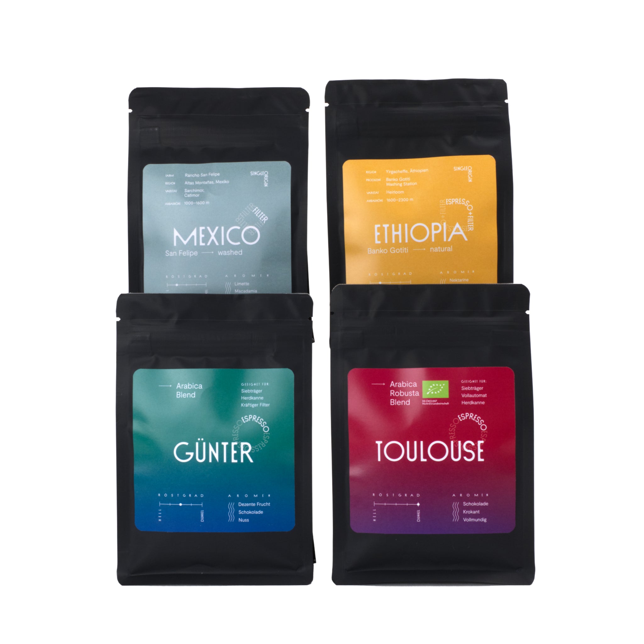 Beispielbild für ein Probierpaket der Günter Coffee Roasters mit vier Kaffees in schwarzen Verpackungen à 100 g.